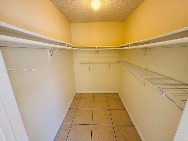 walk in closet featuring tile patterned floors