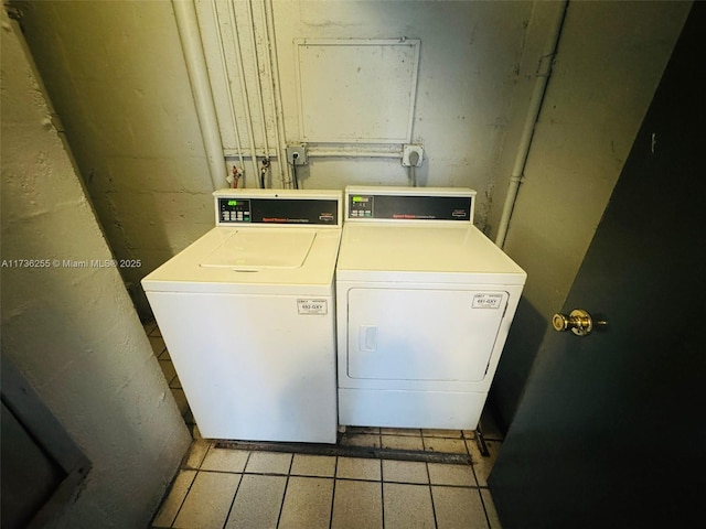 washroom with washer and dryer