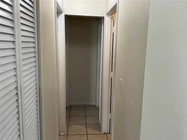 hallway with light tile patterned floors