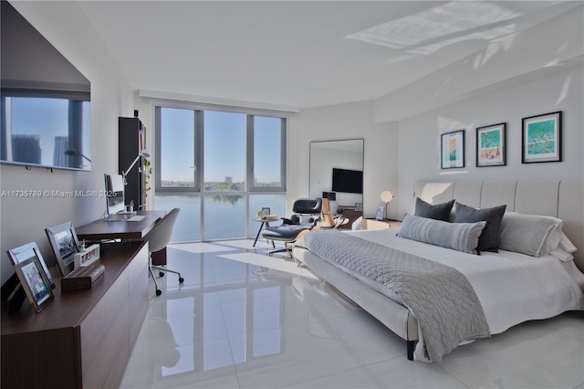 bedroom featuring a wall of windows