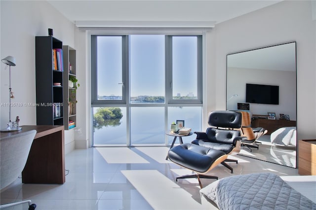 interior space with expansive windows and light tile patterned flooring