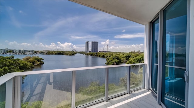 balcony featuring a water view