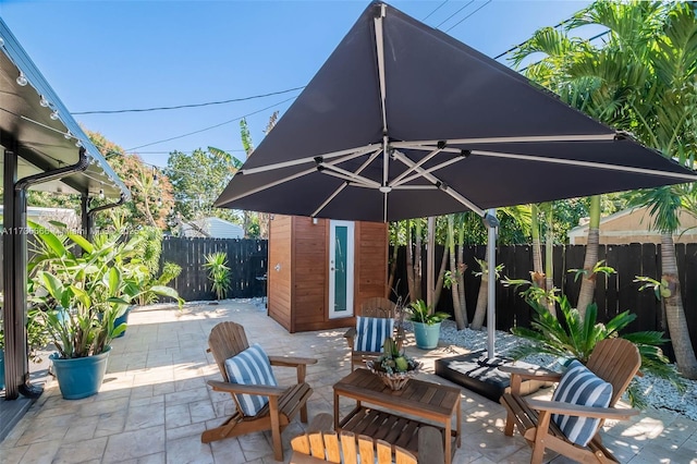 view of patio / terrace with a storage shed