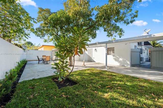 view of yard with a shed and a patio