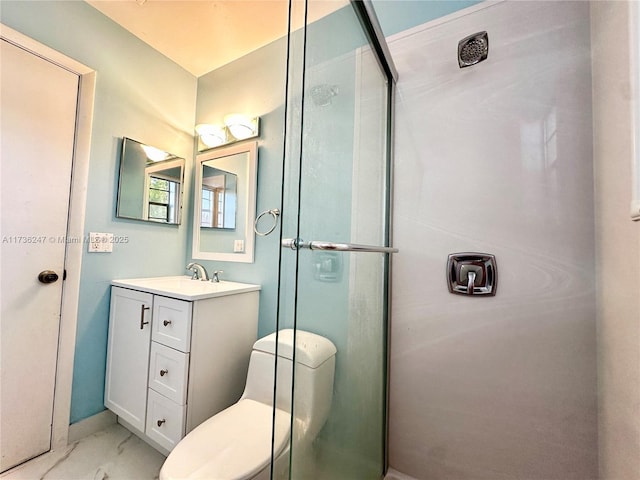 bathroom with vanity, toilet, and an enclosed shower