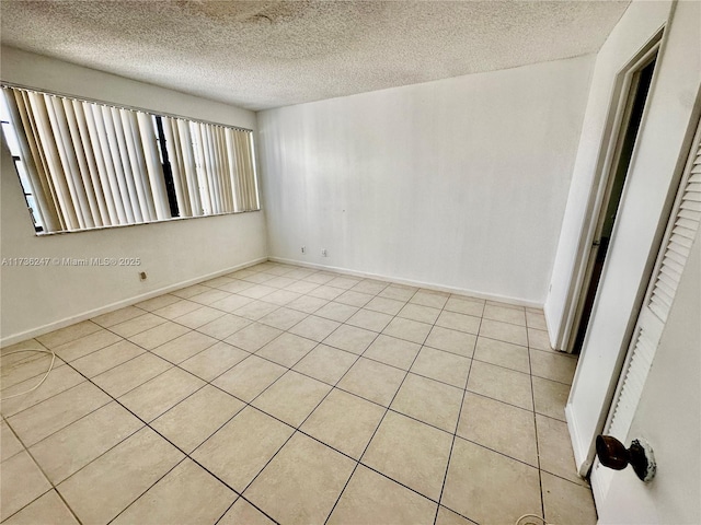 empty room with a textured ceiling