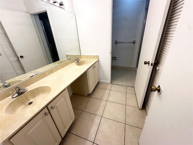 bathroom with tile patterned floors and vanity