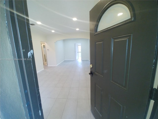 foyer entrance with light tile patterned floors