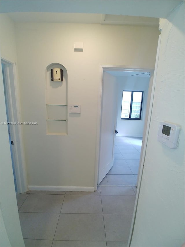 corridor featuring light tile patterned flooring