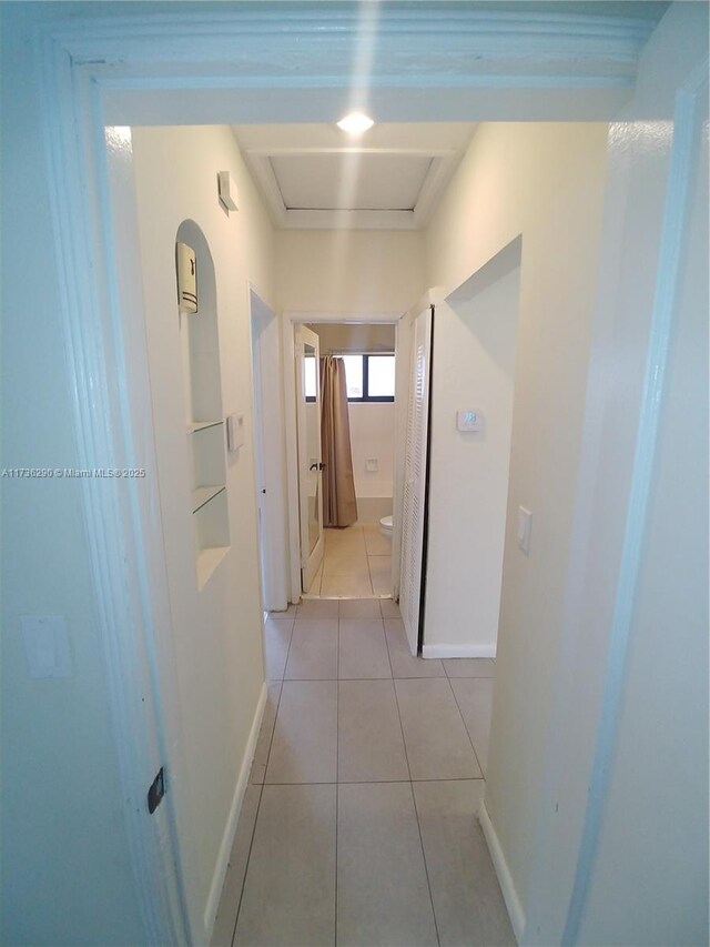 hallway with light tile patterned flooring