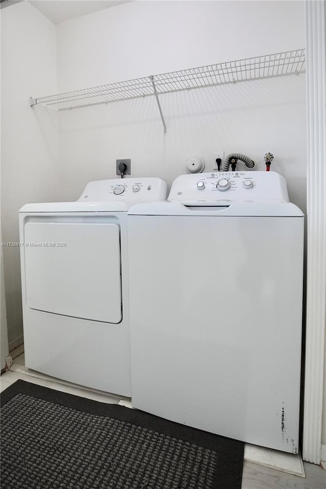 washroom featuring separate washer and dryer