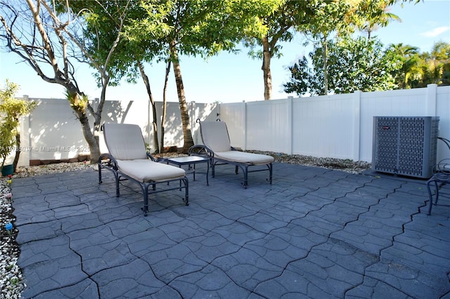 view of patio featuring central AC and a fenced backyard