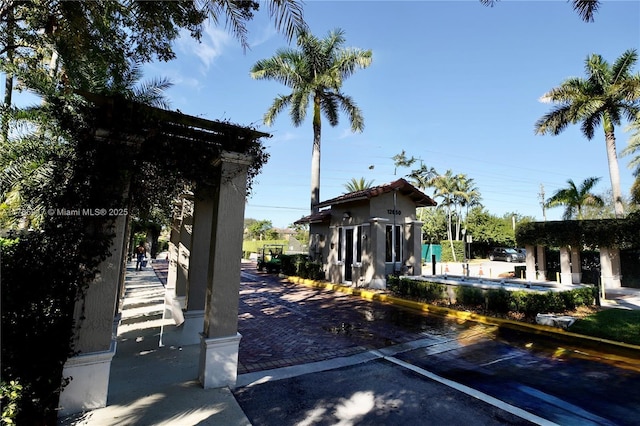 view of community with uncovered parking