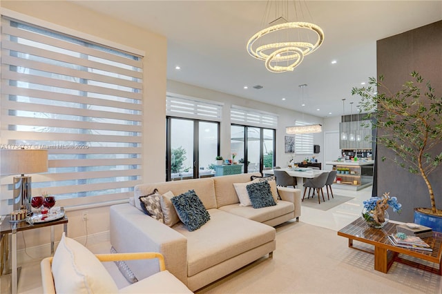 living area with a chandelier and recessed lighting