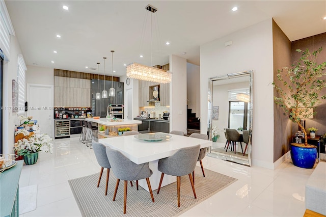 dining area with wine cooler, light tile patterned flooring, baseboards, and recessed lighting