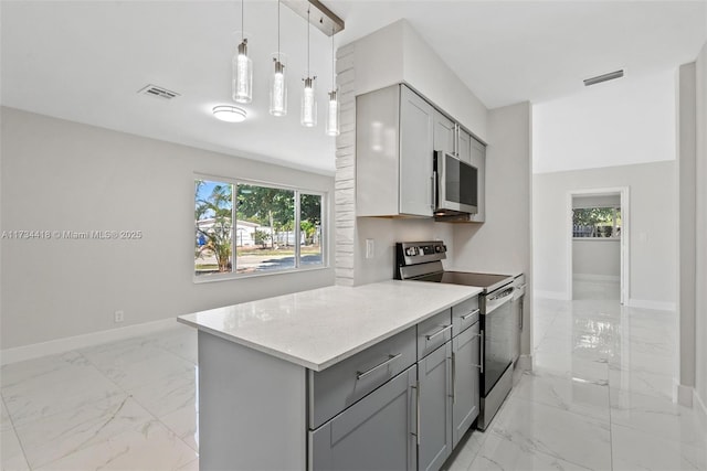 kitchen with pendant lighting, stainless steel electric range, gray cabinets, and light stone countertops