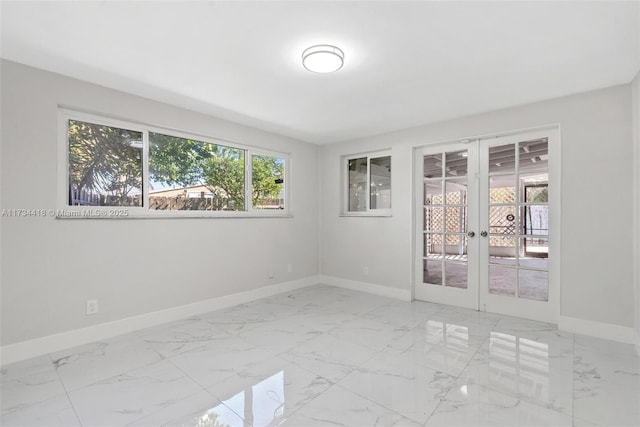 empty room featuring french doors