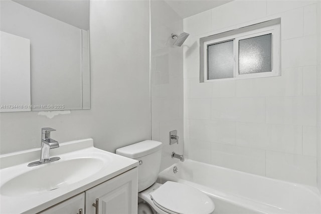 full bathroom featuring vanity, toilet, and tiled shower / bath combo