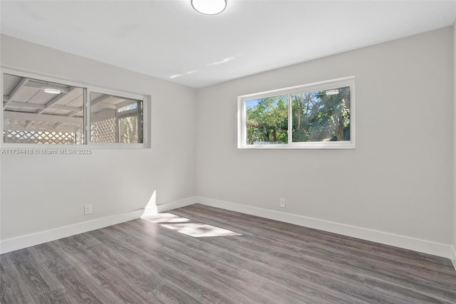 spare room featuring dark hardwood / wood-style floors