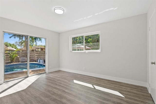 empty room featuring hardwood / wood-style flooring