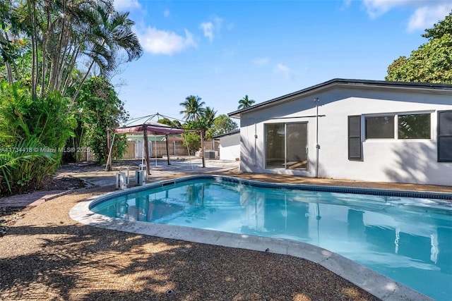 view of swimming pool with a gazebo and a patio area