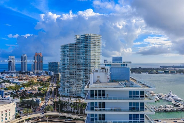 property's view of city featuring a water view