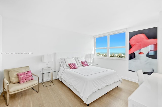 bedroom with light hardwood / wood-style flooring