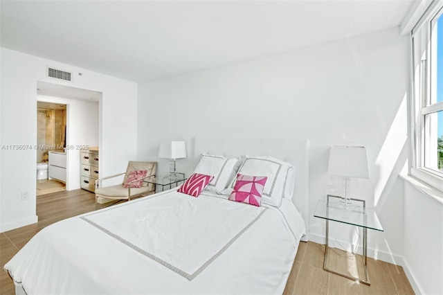 bedroom with wood-type flooring