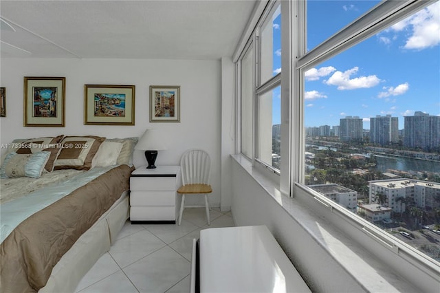 tiled bedroom with multiple windows