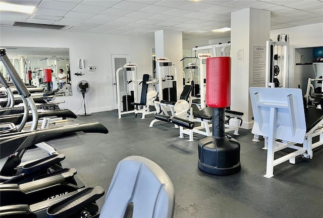 workout area featuring a drop ceiling