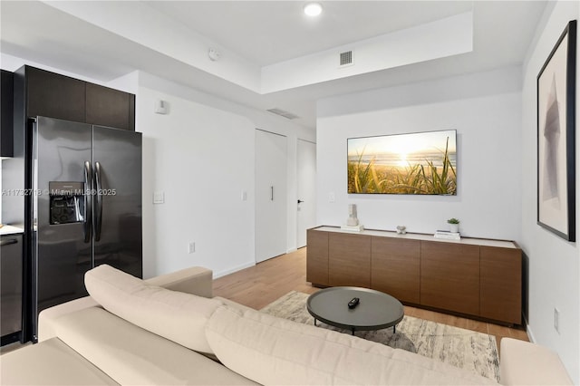 living room with light hardwood / wood-style floors