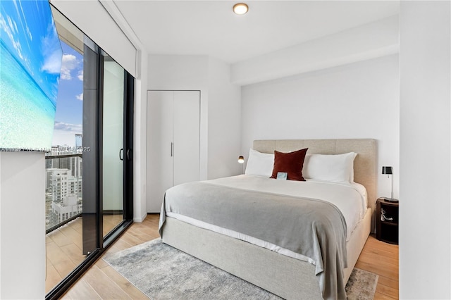 bedroom with light wood-type flooring