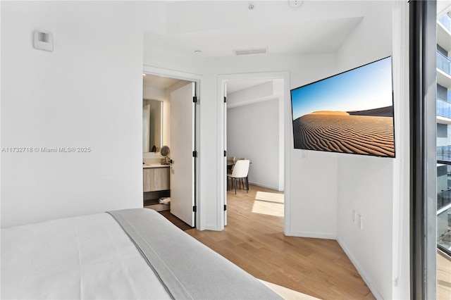 bedroom featuring light wood-type flooring