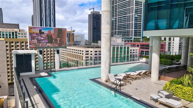 view of swimming pool with a patio