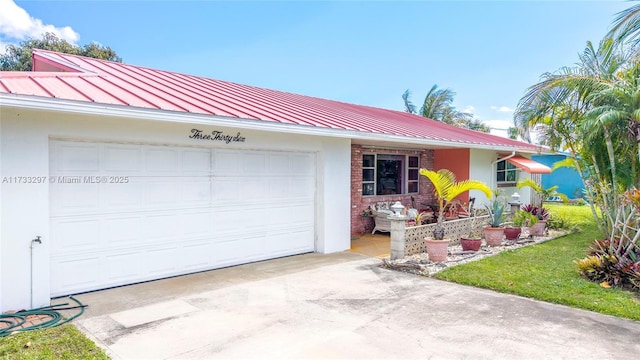 single story home featuring a garage and a front lawn