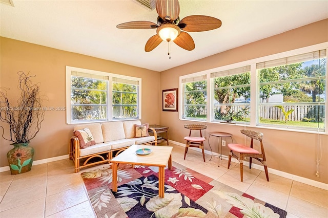 sunroom / solarium with ceiling fan