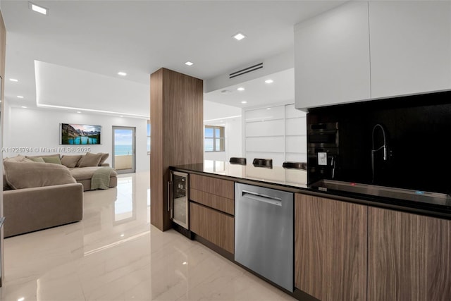 kitchen featuring white cabinets, stainless steel dishwasher, wine cooler, and backsplash