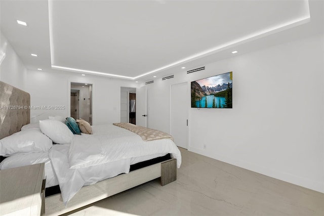 bedroom featuring a raised ceiling