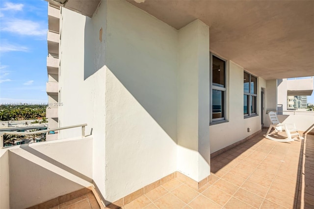 view of side of home featuring a balcony