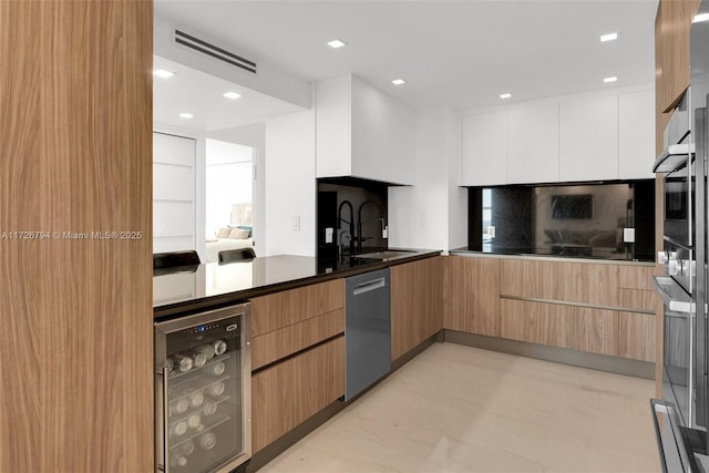 kitchen featuring white cabinetry, sink, wine cooler, backsplash, and stainless steel dishwasher