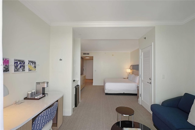 bedroom with light colored carpet, ornamental molding, and electric panel