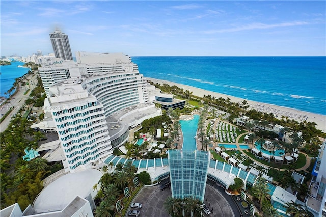 birds eye view of property featuring a view of the beach and a water view