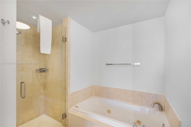 bathroom with separate shower and tub