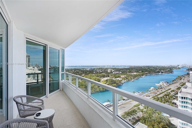 balcony featuring a water view