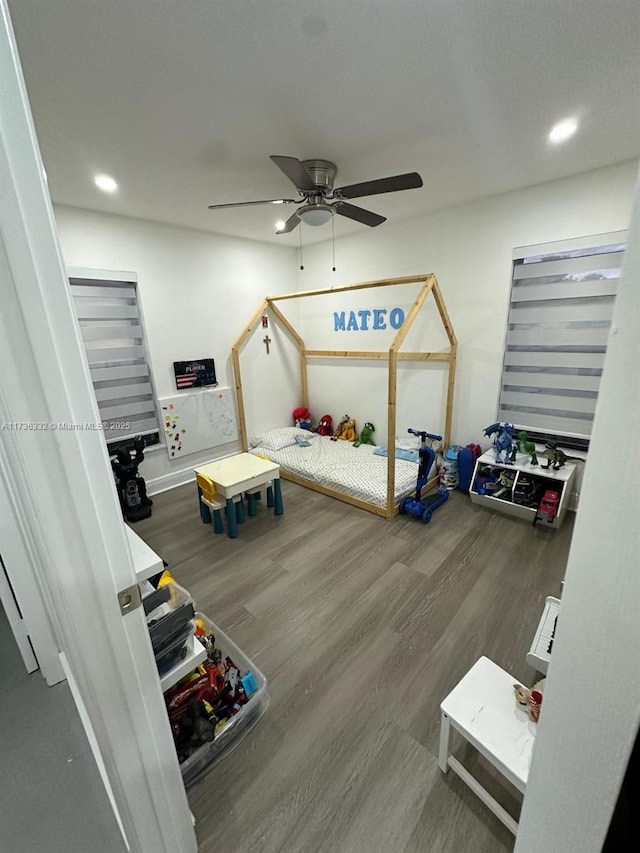 bedroom featuring wood-type flooring and ceiling fan