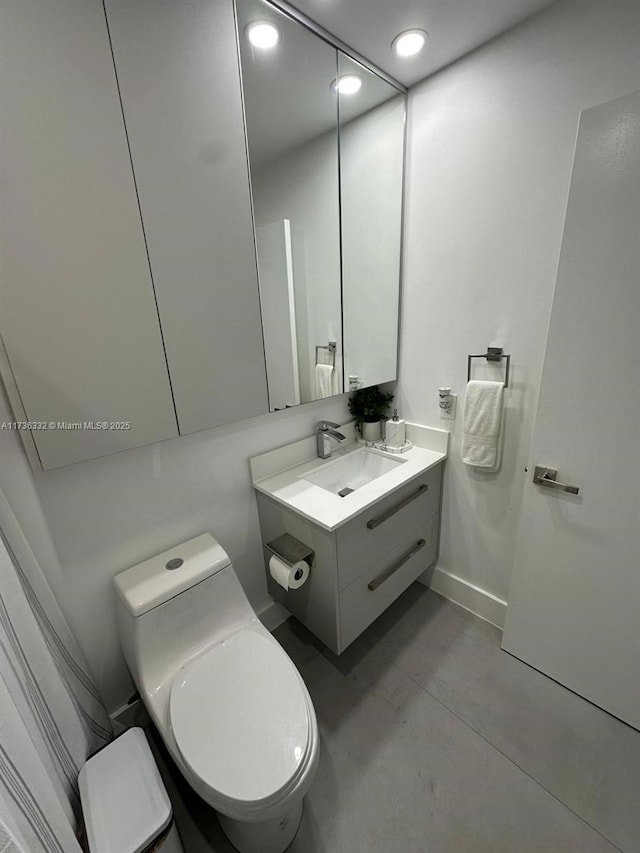 bathroom with vanity and toilet