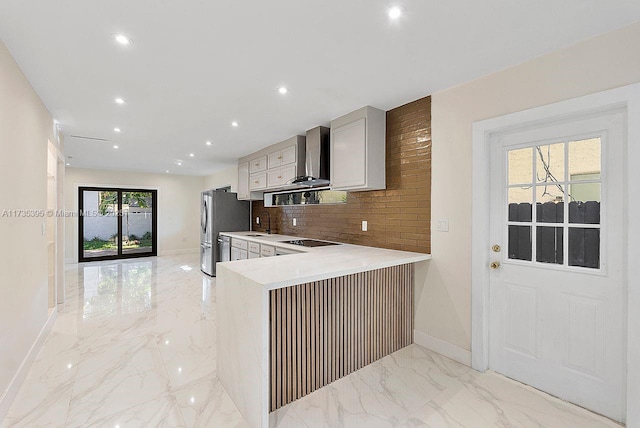 1816 SW 11th Ter, Miami, FL 33135 - kitchen with light marble finish floors, black electric cooktop, freestanding refrigerator, baseboards, and a sink