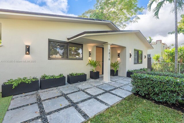 1816 SW 11th Ter, Miami, FL 33135 - view of front of home with stucco siding and a patio