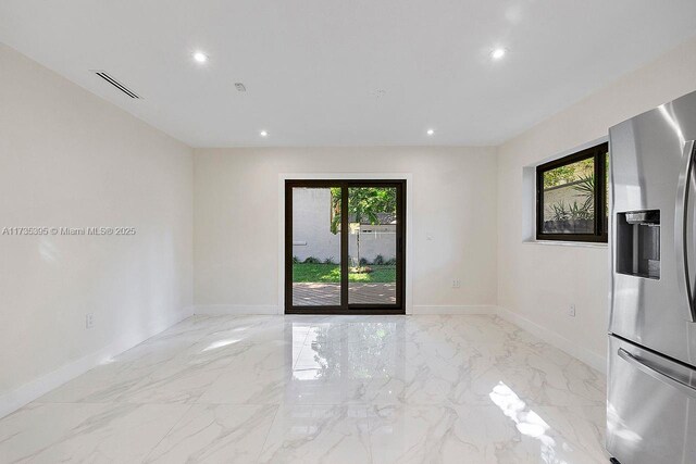 1816 SW 11th Ter, Miami, FL 33135 - spare room featuring baseboards, recessed lighting, and light marble finish floors