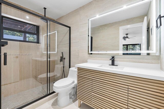 1816 SW 11th Ter, Miami, FL 33135 - bathroom featuring toilet, tile walls, vanity, a shower stall, and ceiling fan